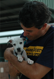 Wayne Pacelle with puppy after Hurricane Katrina