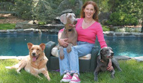 Author and radio host Tracie Hotchner with her three dogs
